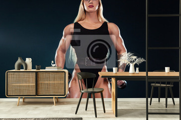 Strong Athletic Woman Bodybuilder With Dumbbells On Dark