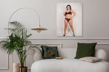 feminine chubby woman with plus size body in black lingerie posing