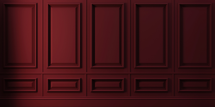 Stuck an einer burgunderfarbenen wand