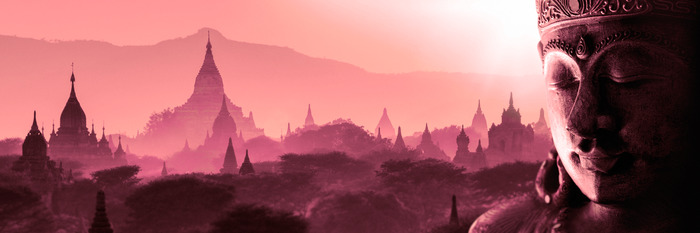 Rosa landschaft mit tempeln und einem halbprofilierten buddha