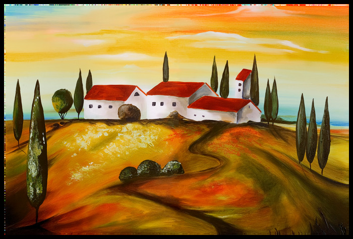 Weiße häuser auf einem hügel, umgeben von zypressen