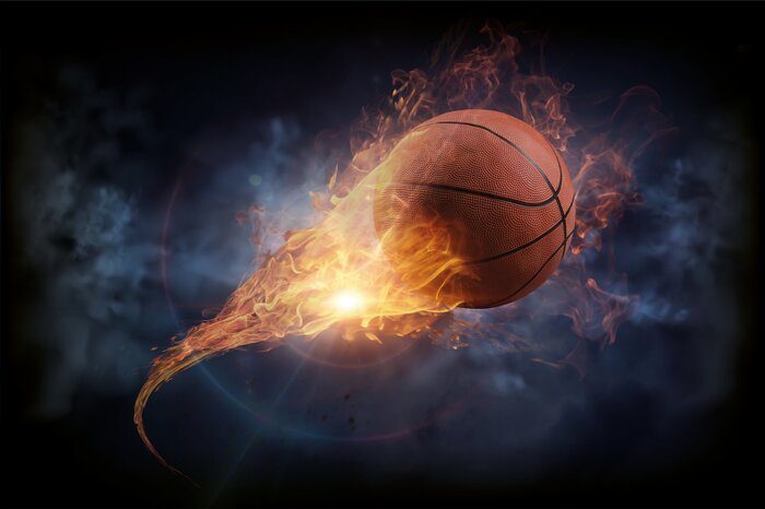 Feuriges basketballspiel in der dunkelheit