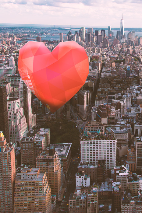 Ein herz, das über den stadtgebäuden schwebt