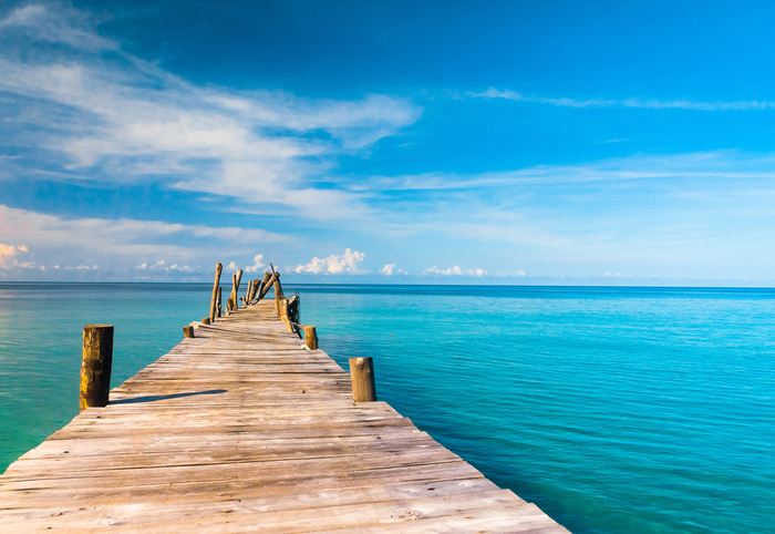 Fototapete Steg am azurblauen Ozean