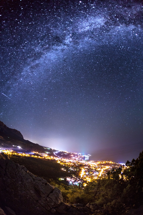 Fototapete Milchstraße über Stadt