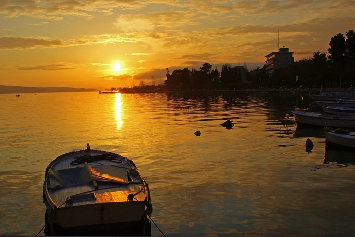 Fototapete Sonnenuntergang und Boot