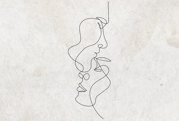 Visages dessinés au trait sur un fond en béton