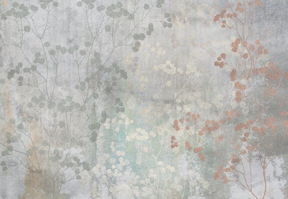 Brindilles avec des feuilles sur du béton gris