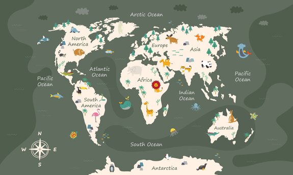 Une carte du monde pour enfants avec des animaux sur fond vert