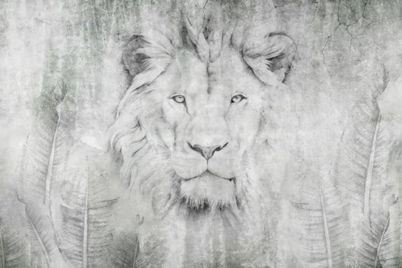 Tête de lion parmi les feuilles sur un mur