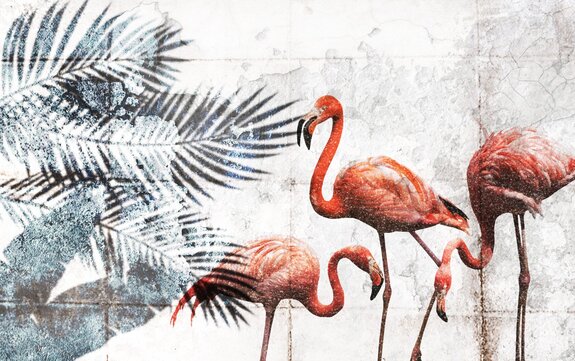 Flamants roses et feuilles tropicales sur un fond en béton
