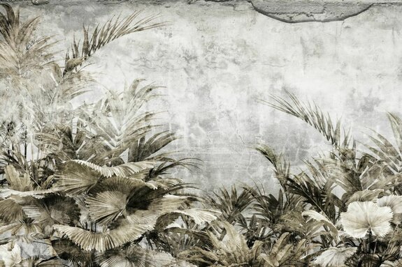 Feuilles tropicales sur fond en béton