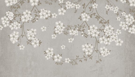 Branches avec des fleurs blanches sur béton