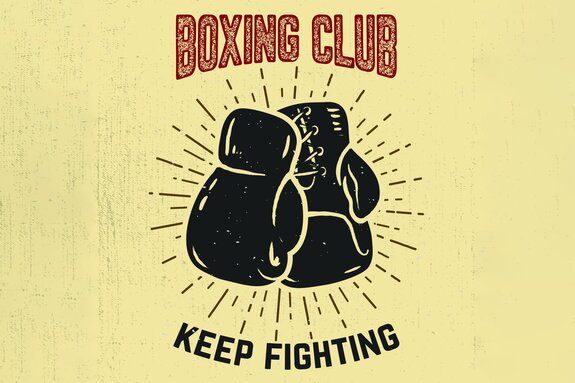 Gants de boxe sur fond jaune