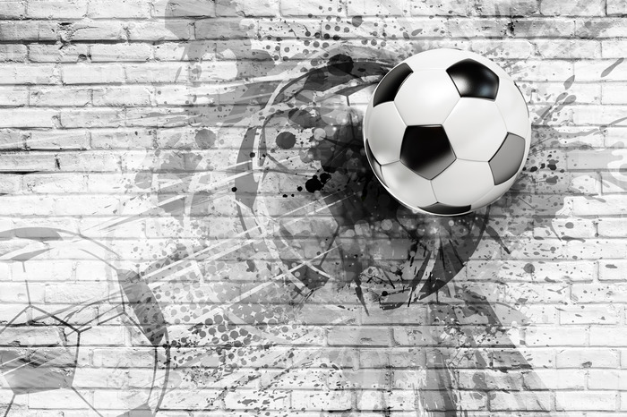 Composition de football avec un ballon et une brique