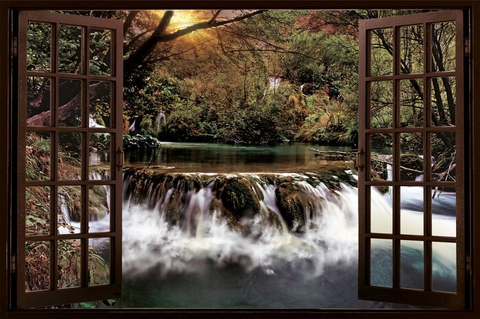 Un ruisseau coule à travers la verdure à l'extérieur de la fenêtre