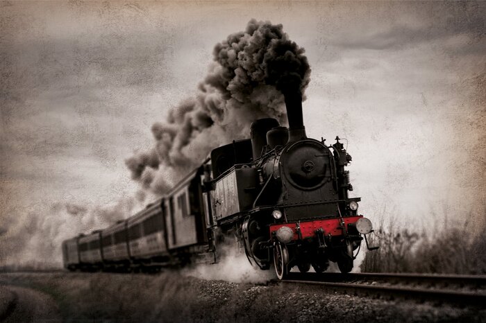 Train fumant sur les rails