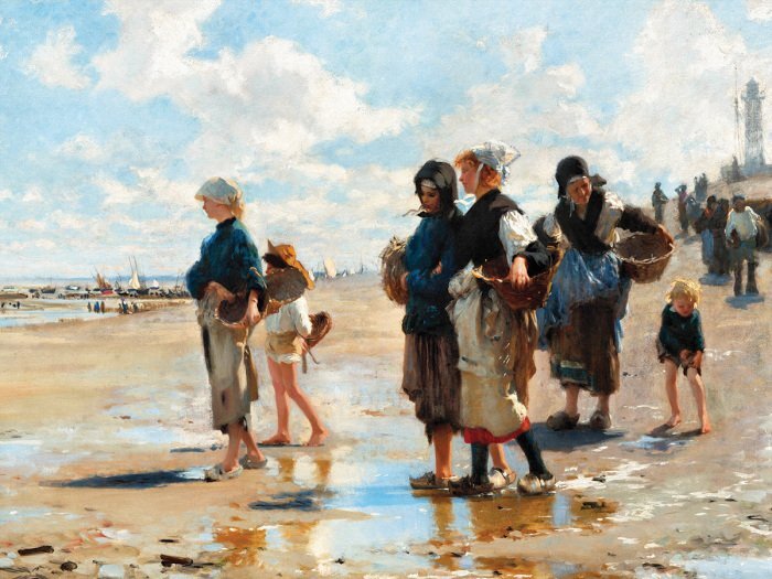 Des femmes et des enfants pêchent sur une plage en bord de mer