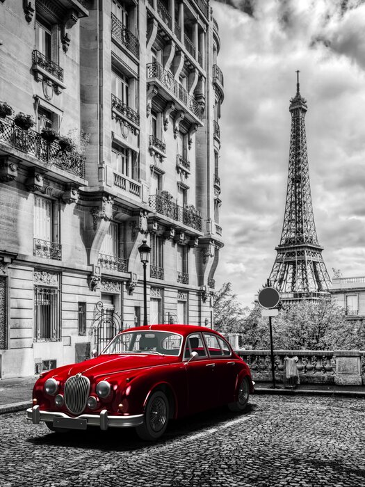 Voiture rétro rouge et la tour eiffel à paris