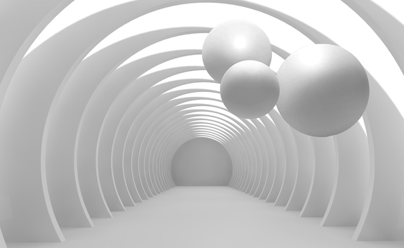 Een witte tunnel met drie ballen