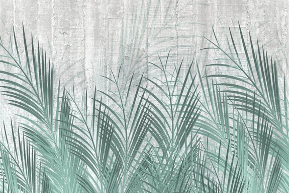 Groene palmbladeren op een grijze betonnen achtergrond