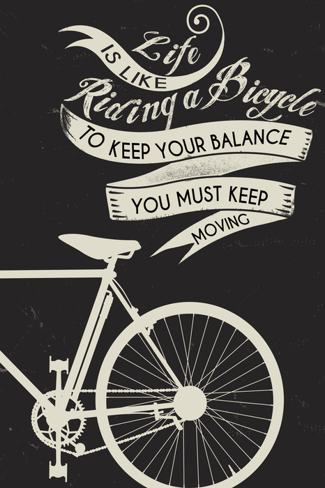 Een fiets met een motiverende quote
