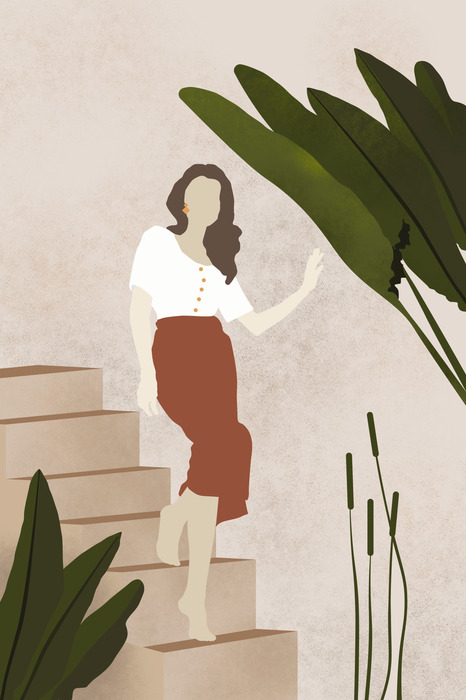 Vrouw op de trap met bladeren