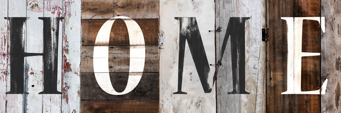 Het opschrift "huis" op de achtergrond van de planken