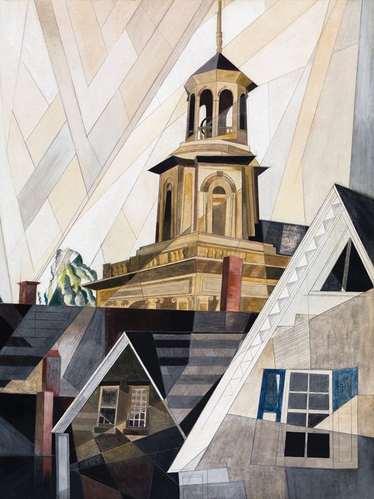 Kubistische gebouwen met een toren tegen een heldere lucht