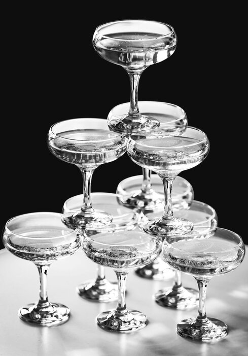 Black-and-white photograph of champagne glasses