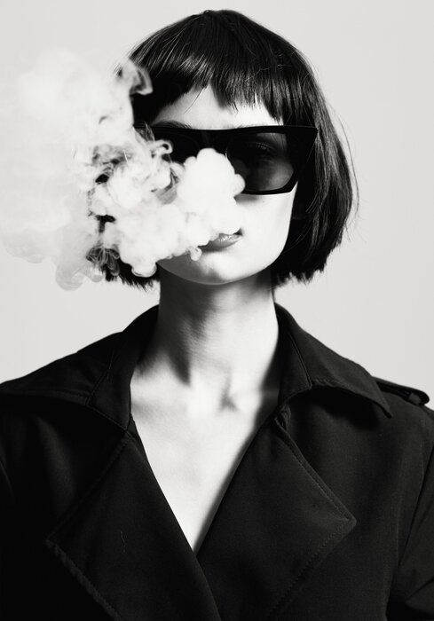 Black-and-white portrait of a woman in glamour style