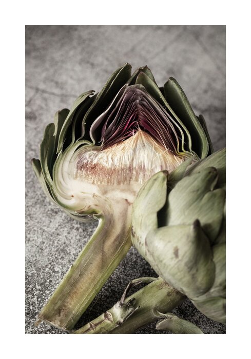 Green artichokes on a grey background