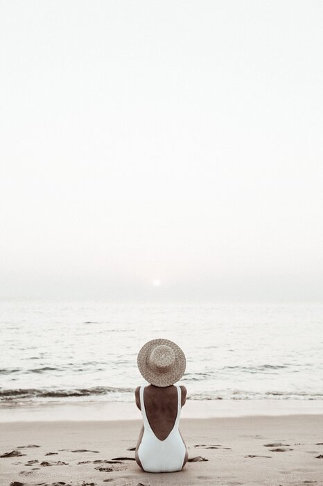Woman on the beach and sea landscape