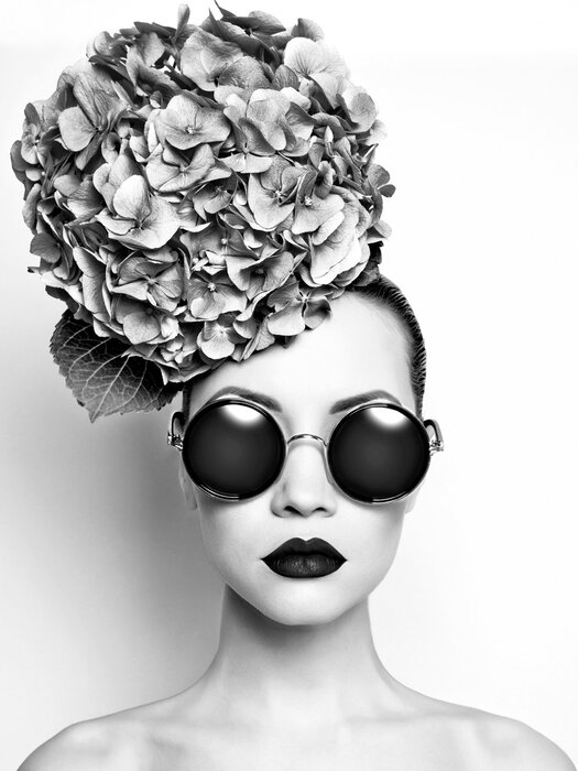 Black-and-white portrait of a woman with hydrangea flowers