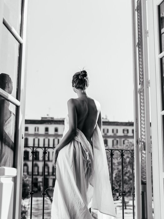 Woman on a balcony black-and-white photograph
